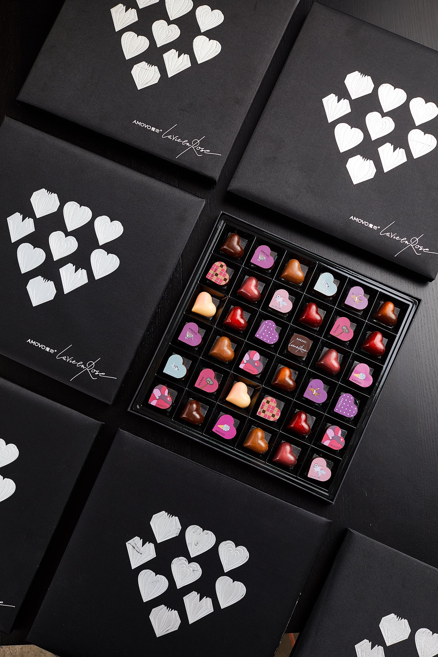 Amotrio's chocolate gift box is fun and interesting gifts for many, having different flavors like coffee, milk chocolate, jasmine, or white chocolate