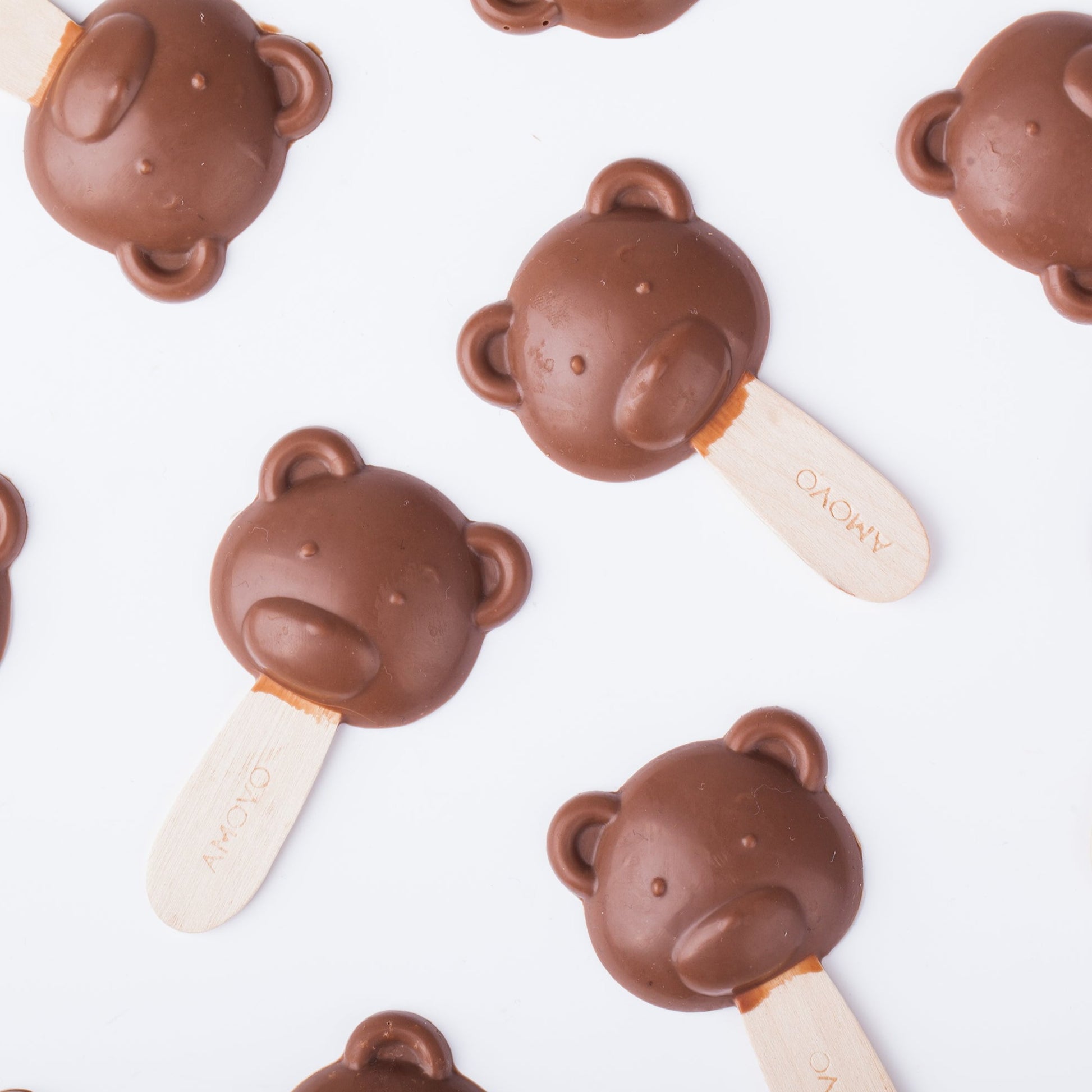 Real image of bear-shaped milk chocolate lollipop made with pure cocoa butter