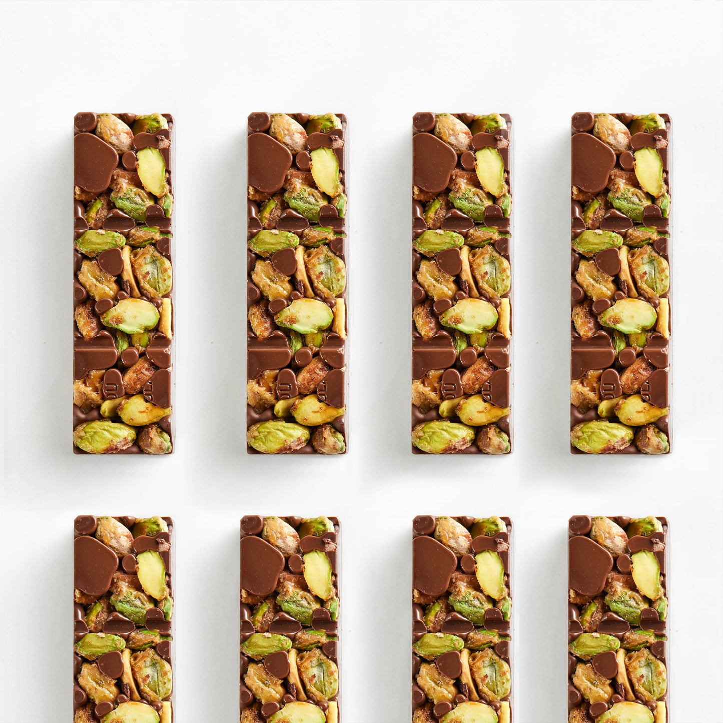 Real photo of Amotrio pistachio chocolate bar with whole, uncut pistachios